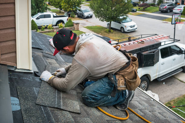 Professional Roofing technician working in Badger, IA
